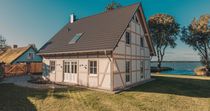 Watermark Usedom - Ferienhaus Welle direkt am Wasser mit privater Badestelle